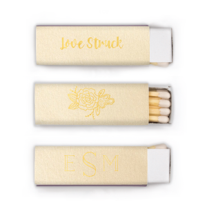 The Monogram Flower Matchbox design combines simplicity with elegance. On one side, a modern monogram in a refined font represents the couple. The other side features a single peony, symbolizing love, honor, and joy, amidst lush greenery. This matchbox is a subtle yet meaningful nod to lasting love and beauty.