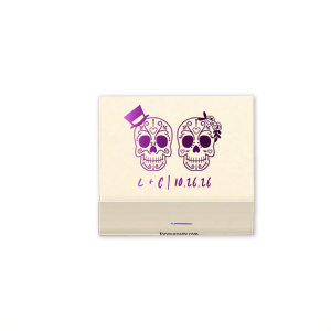 Celebrate love and life with the Sugar Skull Couple Match. Featuring vibrantly detailed skulls adorned with a top hat and floral headband, this artistic design nods to the joyous spirit of Día de los Muertos. Displaying the couple's initials and event date, it's a colorful keepsake full of cultural charm and festivity.