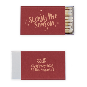 Sleigh The Season Matchbook is a deep cranberry matchbook with playful script and twinkling stars in warm taupe ink; the back adds a sweet sleigh icon and custom holiday text—cozy, spark-ready favors for Christmas parties and winter weddings.