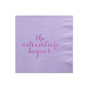 The Elegant Swirl Script Adventure Begins Napkin captures the essence of a new journey with "The Adventure Begins" in an energetic swirling script. This straightforward design, focusing on the excitement of the couple's upcoming life together, makes a striking statement.