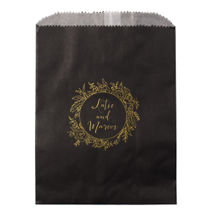 The Regal Wreath Bag design presents an elegant and abundant floral wreath, symbolizing luxury and nature's richness. Enclosed within this lush botanical embrace, the couple's names are elegantly scripted, adding a touch of royal sophistication. This design artfully marries opulence with the charm of natural abundance.