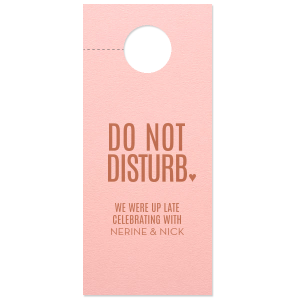 Enhance your destination wedding with the Up Late Door Hanger. It prominently displays "DO NOT DISTURB" in large, all-caps font, softened by a small heart. Below, "We were up late celebrating with..." invites personalization with the couple's names, adding a modern, playful touch to this thoughtful keepsake.