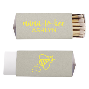 Strike up excitement for the 'Mama to Bee' with these adorable matches, buzzing with anticipation. The Mama to Bee Matchbox design has a sweet bee gracing the back, while the front honors the guest of honor, kindling joy for the baby's impending arrival.