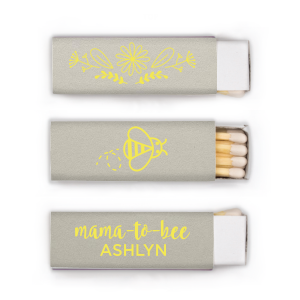 Strike up excitement for the 'Mama to Bee' with these adorable matches, buzzing with anticipation. The Mama to Bee Matchbox design has a sweet bee gracing the back, while the front honors the guest of honor, kindling joy for the baby's impending arrival.