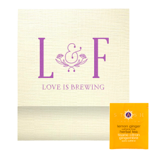 Savor the moment with the Love Is Brewing Tea Favor, where a lush floral garland encircles a bespoke ampersand, linking the couple's initials. 'Love is Brewing' unfurls below, infusing your celebration with aromatic elegance and a hint of whimsy.