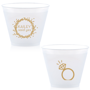 Cheers to the newly betrothed with the Engagement Ring Cup, bursting with celebratory bubbles and a bright 'said yes.' Flip to reveal a sparkling solitaire ring, toasting to the promise of a dazzling future together.
