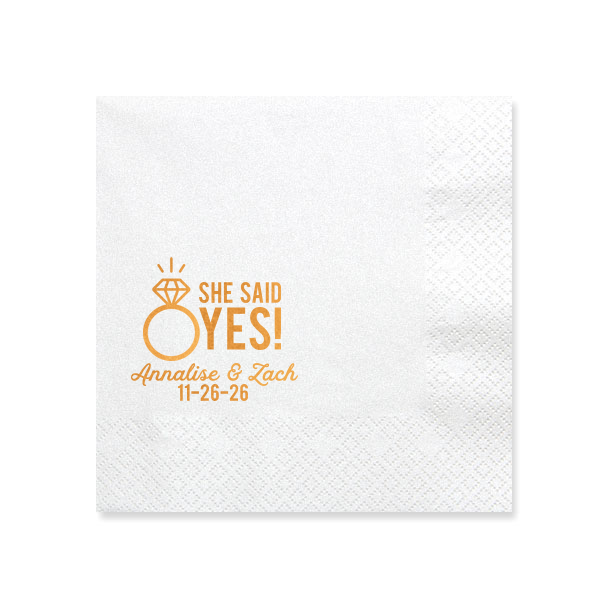 The She Said Yes! Diamond Ring Napkin features bold celebratory lettering, your name and special date, elegant script,t and a sparkling ring icon for a joyful announcement detail. Set it out to share the excitement and invite guests to celebrate together. Just right for engagement parties, or proposal celebrations!