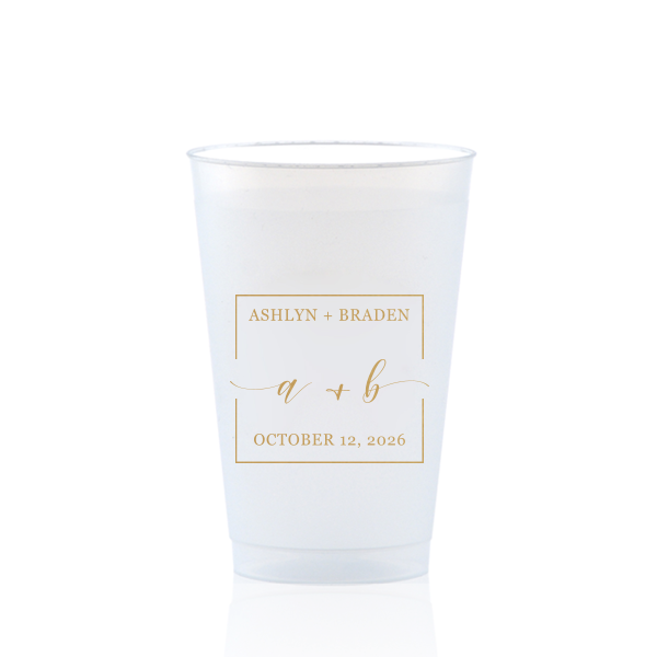 The Square Monogram Frame Cup features elegant script of the couple’s initials, paired with their names and special date within a clean rectangular border for a refined drinkware detail. Use it to elevate beverage service with a polished, personalized touch. Refined for wedding receptions or rehearsal dinners.