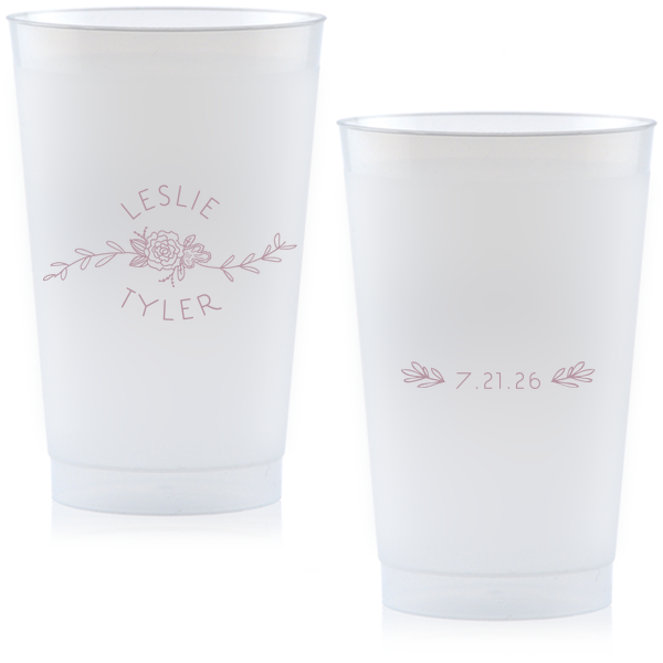 Captivate your guests with the Peony Flourish Names Frosted Cup, featuring a charming heart-leaf flourish and a central peony. This elegantly stacked design beautifully intertwines the couple's names, creating an air of sweet simplicity and sophistication for your memorable celebration.