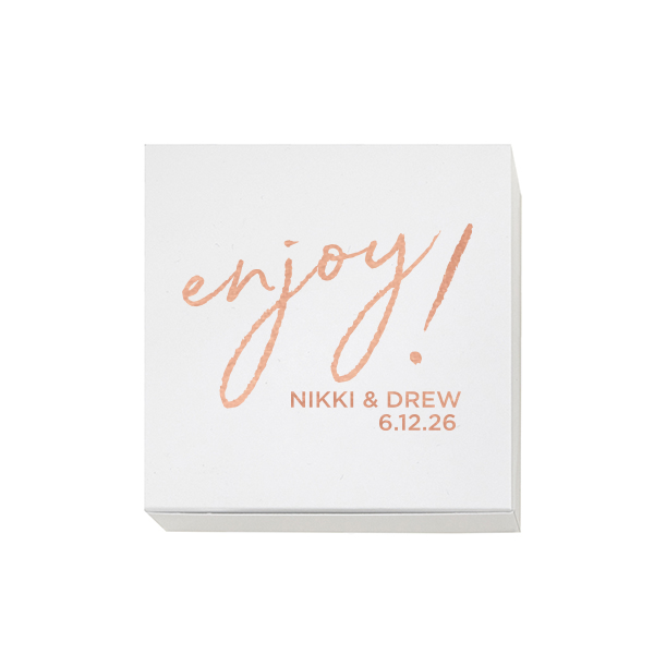 Invite a burst of happiness with the Enjoy! Favor Box. The design centers around a playful “Enjoy!” in whimsical, lower-case script, exuding an air of fun and excitement. Beneath this cheerful exclamation, the couple’s names and the celebration date add a personal touch, making this favor box a delightful parting gift to their guests. "