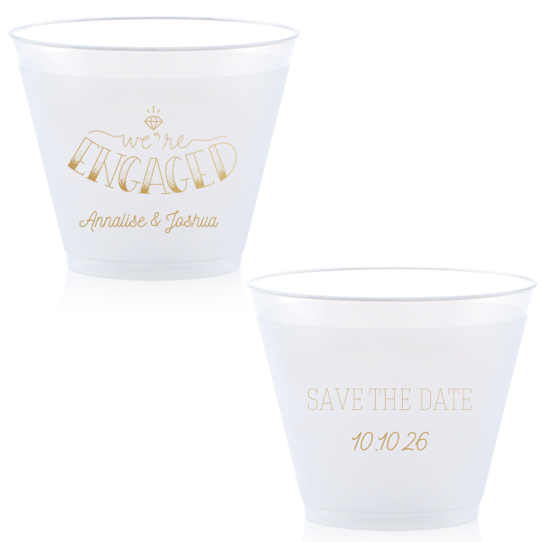 The Diamond Engagement Cup design dazzles with a sparkling diamond graphic and bold "ENGAGED" in 3D artistry. Scripted "we’re" and the couple's names add charm, while the other side cheerfully announces "Save the Date," infusing the cup with celebratory excitement and anticipation.