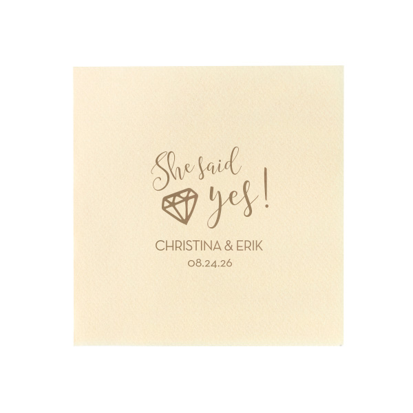 With the She Said Yes Diamond Engagement Napkin, let the fun begin! This exuberant design nestles a sparkling diamond into the joyful exclamation, perfect for celebrating a lifetime of love. Personalize with the couple's name and date for an unforgettable celebration.

