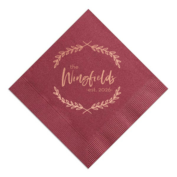 The Foliage Framed Family Napkin exudes timeless elegance with a delicate garland encircling your family's surname, crowned with the "established" year. This richly hued napkin becomes a classic keepsake for weddings or housewarmings, celebrating both new beginnings and established bonds with sophistication.