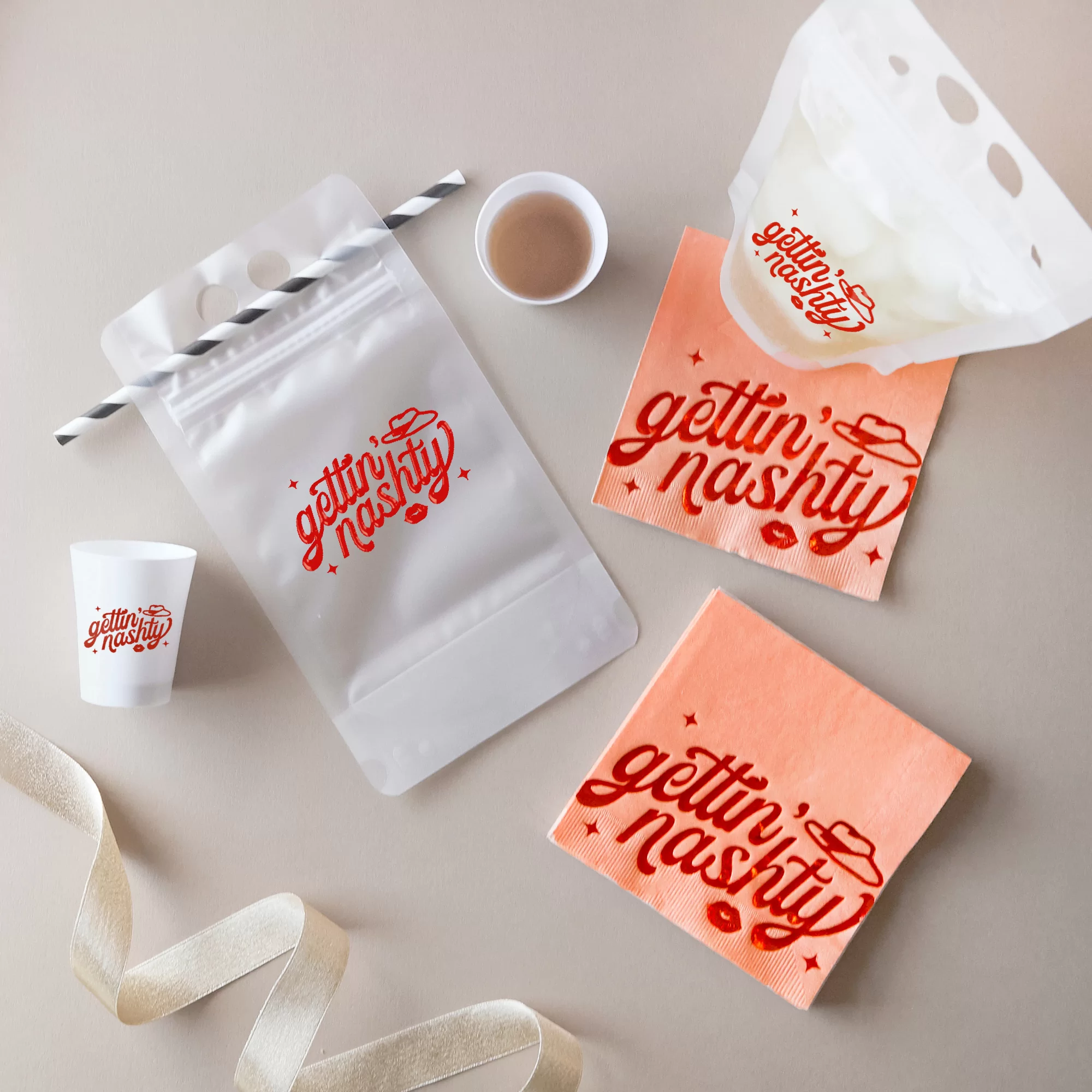 Party scene with drink pouches and shot glasses