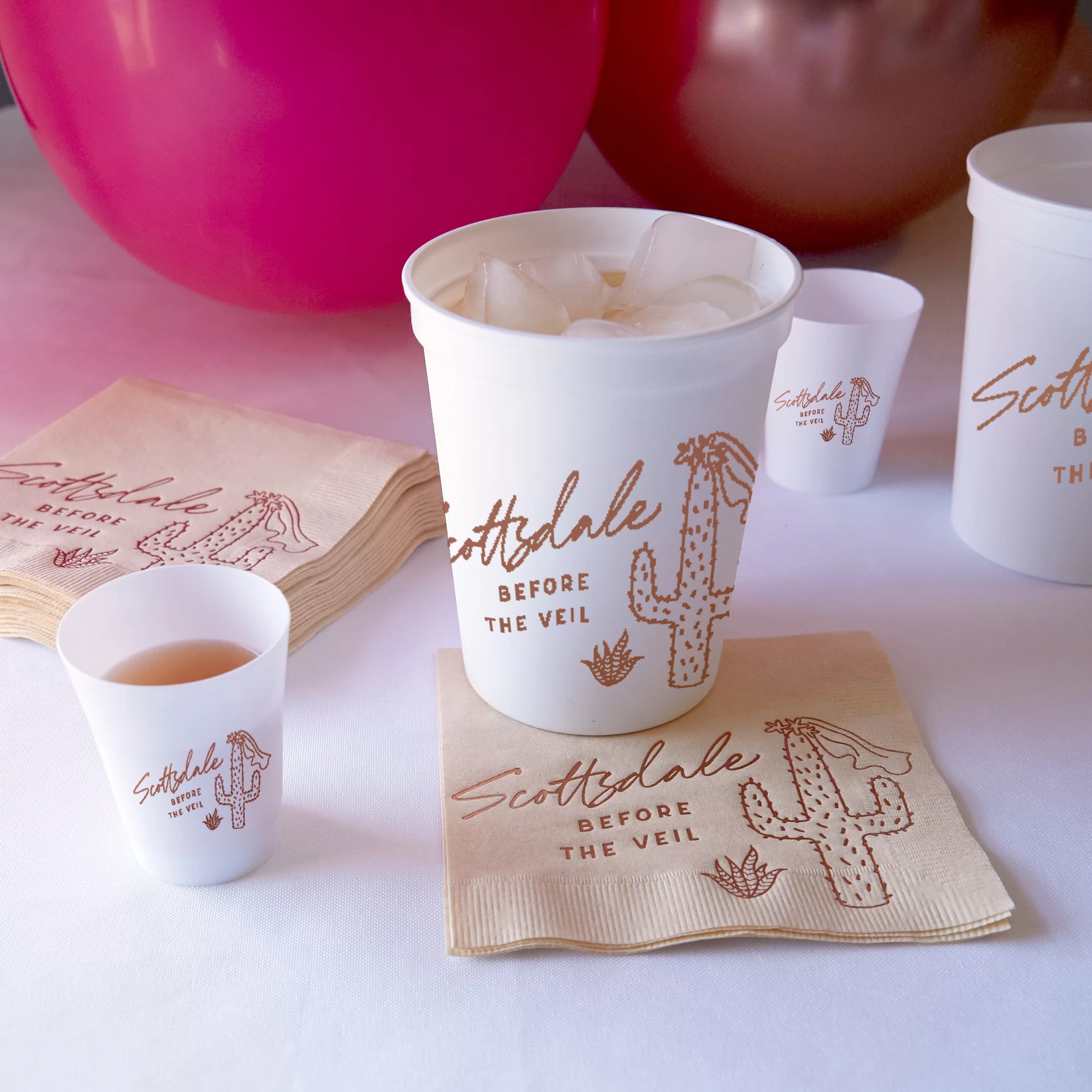 Party scene with white cup and shot glasses