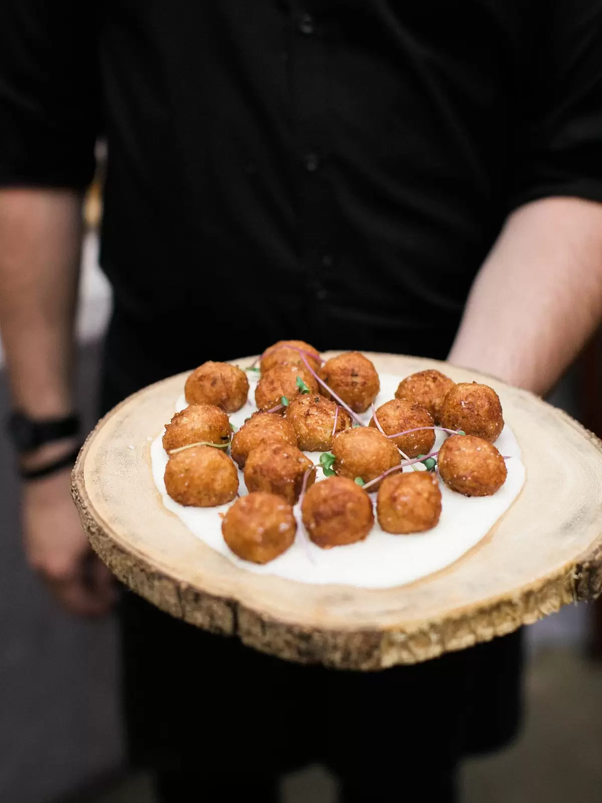 passed appetizers on a creative wood platter
