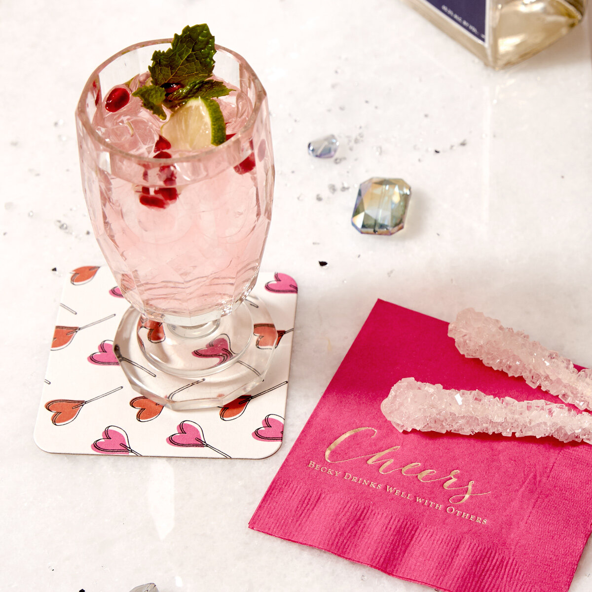 fruity gin cocktail with personalized cocktail napkin