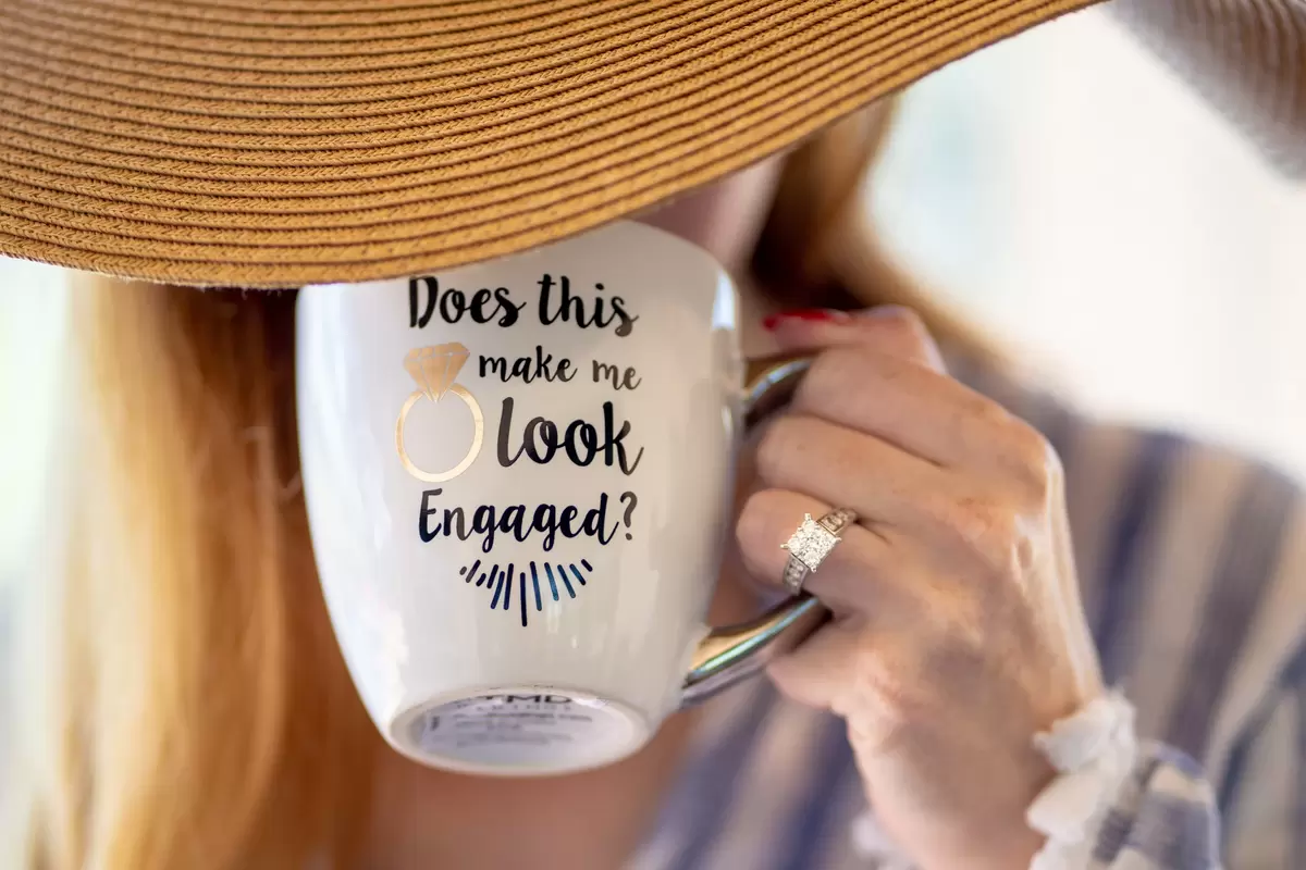 engaged woman sipping from clever mug photo by Jose Martinez