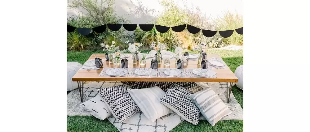 extravagant outdoor seating tablescape at black and white milk themed birthday party