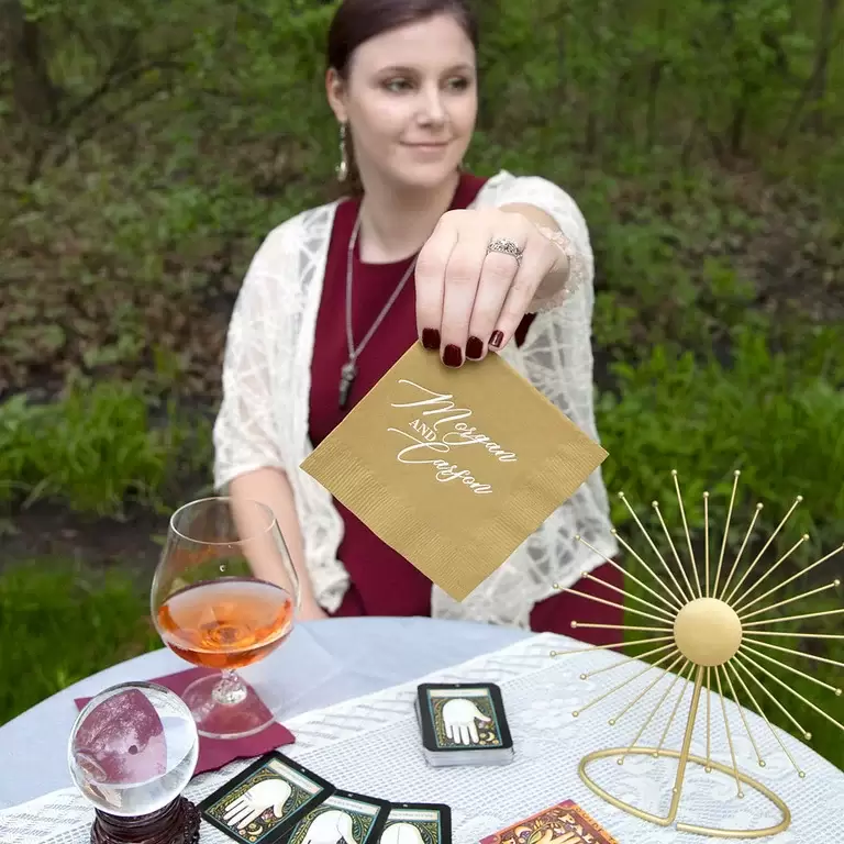 Custom cocktail napkins, cups and matches add a personalized layer to your gathering