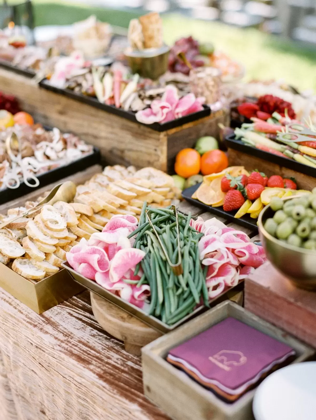 Their wedding logo amongst the grazing table on napkins!