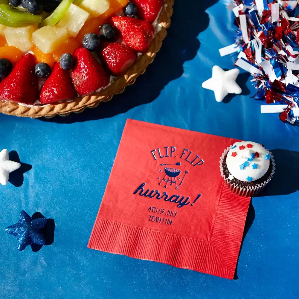 Red Napkin with phrase “Flip Flip Hooray!” on a table with desserts 