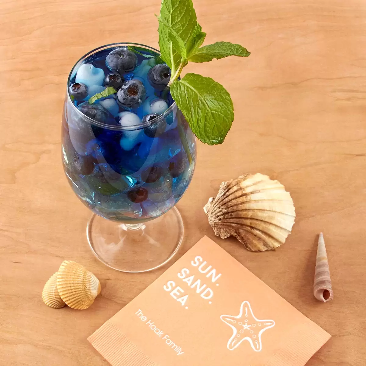 blue beach drink with personalized cocktail napkin