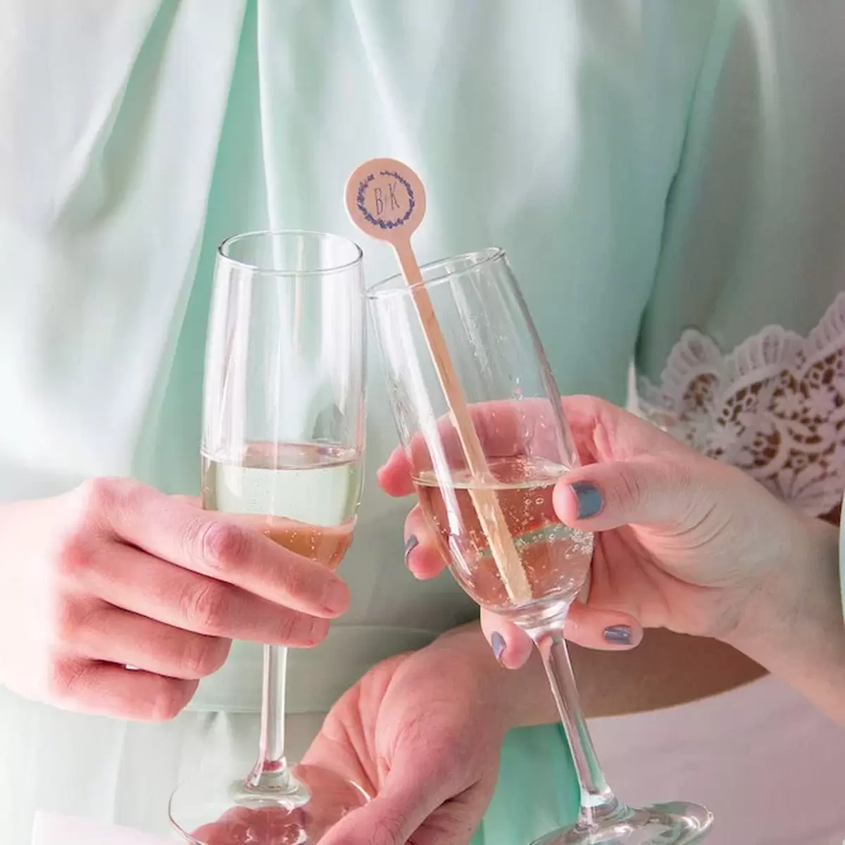 wedding champagne toast with custom cocktail stirrers