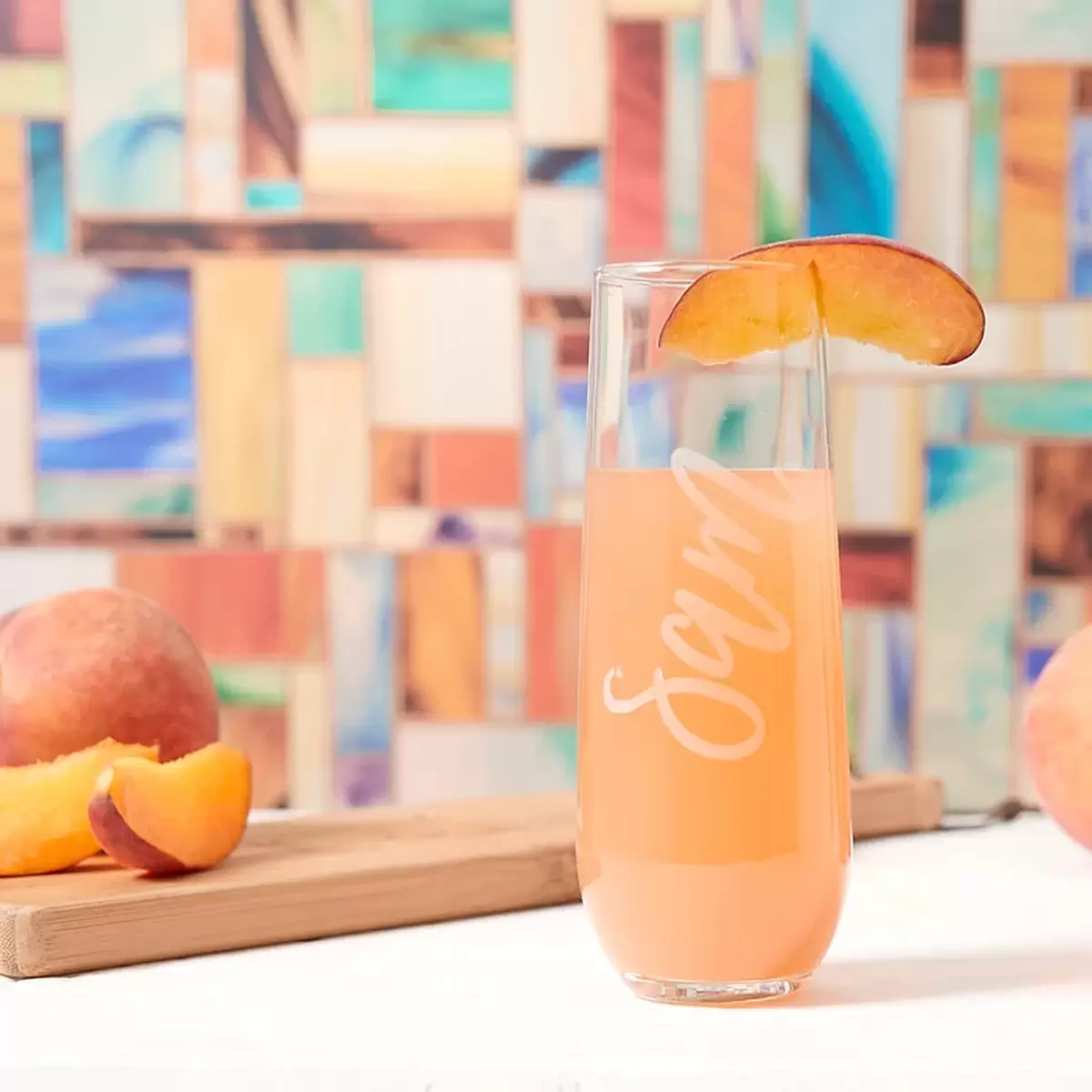 Sip your simple peach bellini from personalized glassware this summer